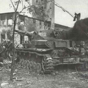 Russian soldiers storm at a burning, outdated PzKpfw IV