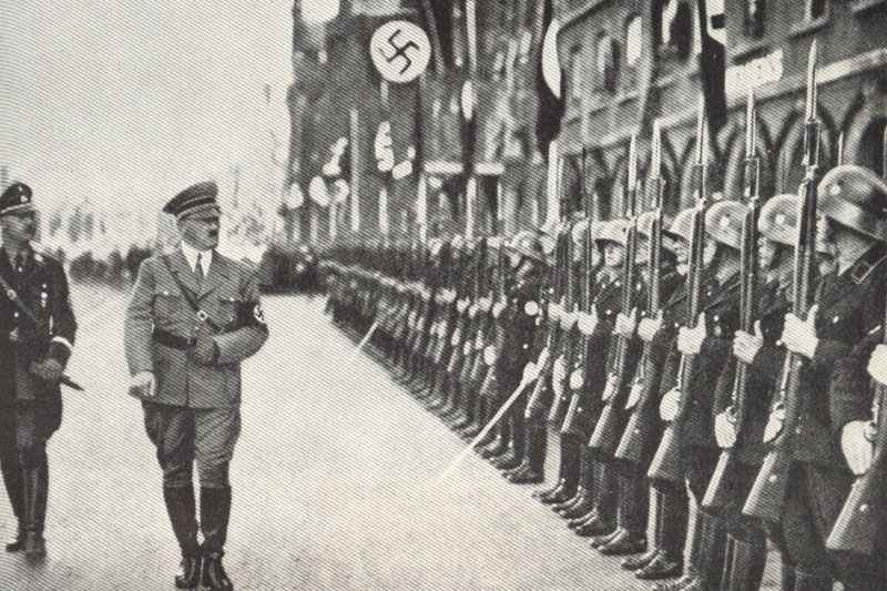 Himmler and Hitler walking in front of a SS honour guard company.