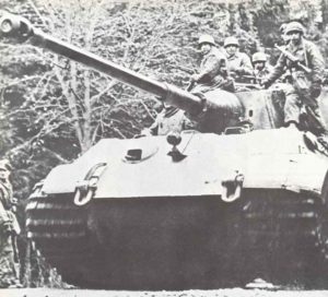 King Tiger tank with infantry at the Battle of the Bulge