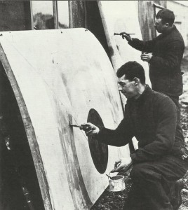 British ground staff is painting wing parts with the new markings