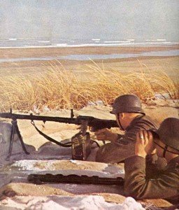 Two German soldiers with their MG34 man a defensive post on the Channel coast