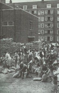 children filling sandbags