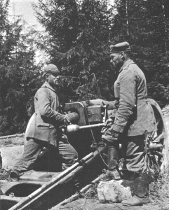 German artillerymen prepare to fire a howitzer