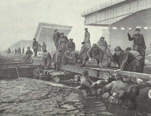 Russian pioneers build a pontoon bridge