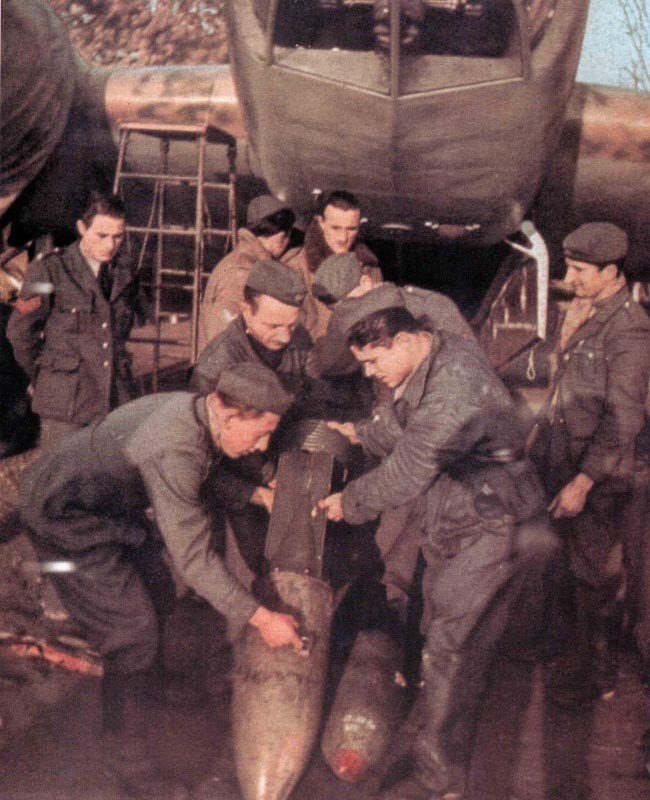 Italian ground crew is loading a bomber