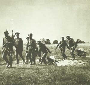 German sentry moves a party of Russian machine-gunners