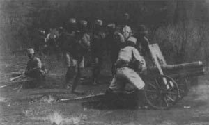 Belgian gunners firing a French 70mm mountain gun 