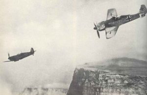 Fw 190 fighters follows a Spitfire