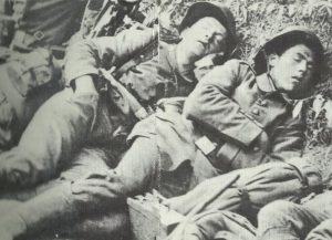 Exhausted soldiers holding a short sleep