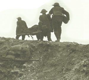 British stretcher-bearers carry a wounded soldier away