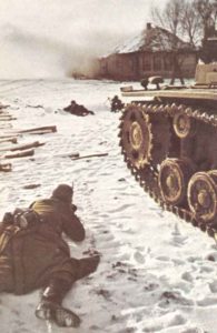 ^German infantry with tank support fighting for a village near Moscow.