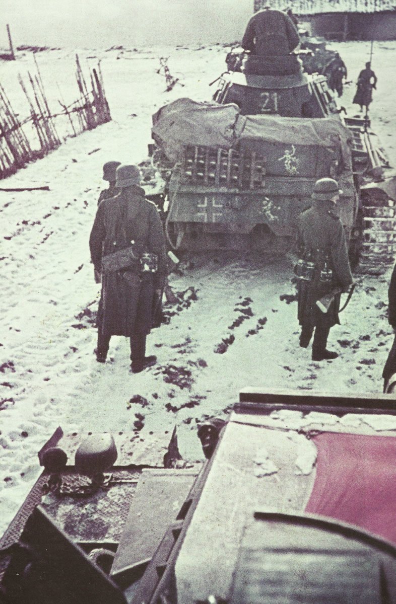 Column of German tanks with infantry in front of Moscow.