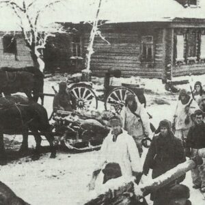 Soldiers of the Red Army move through a retaken village.