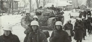 German armored vehicles and infantrymen on the march