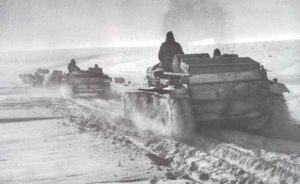 StuG assault guns on their way through snow fields 