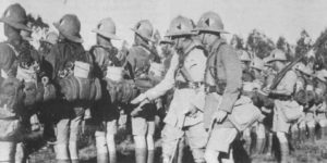 Two officers inspect South African infantry