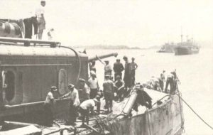 crew of the US cruiser Marblehead inspects destructions 