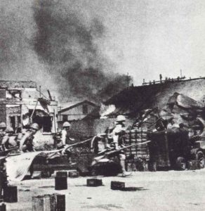 Japanese soldiers capture the railway station of Rangoon. 