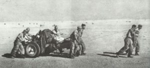  German paratroopers pull gun through the desert