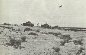 Stuka flies over panzer