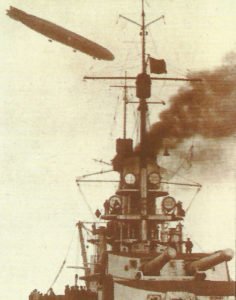 Zeppelin above a 'Kaiser' class battleship