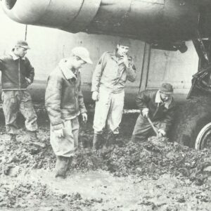 Trying to dig out a B-24 Liberator from mud