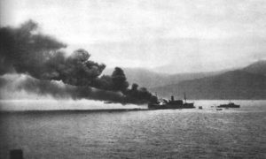 Allied transport ship burning in the port of Bougie
