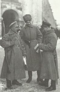 Russian soldiers reading  propganda leaflets