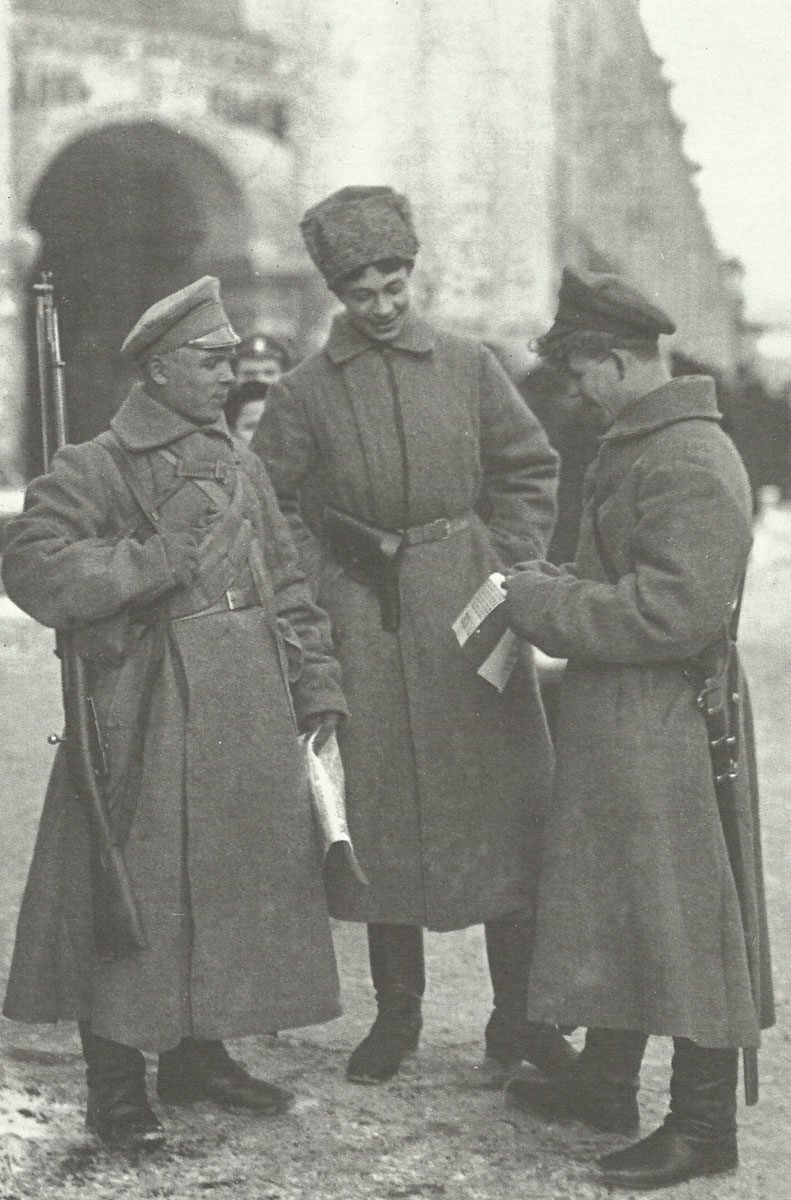 Russian soldiers reading propganda leaflets