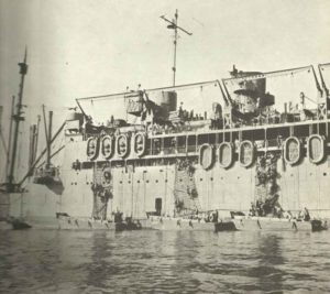 soldiers are climbing from the attack transport McCawley in landing crafts