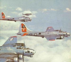 P-51B Mustang escort fighter next to a formation of B-17G 