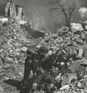 wounded soldier in the ruins of Cassino